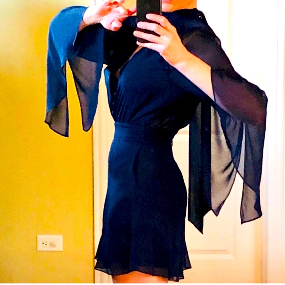 Elegant Nicholas silk romper with tie-back neck and flowing sleeves, chic fit.